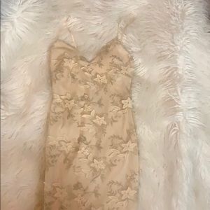 Olive Tree dress with a sheer floral overlay.